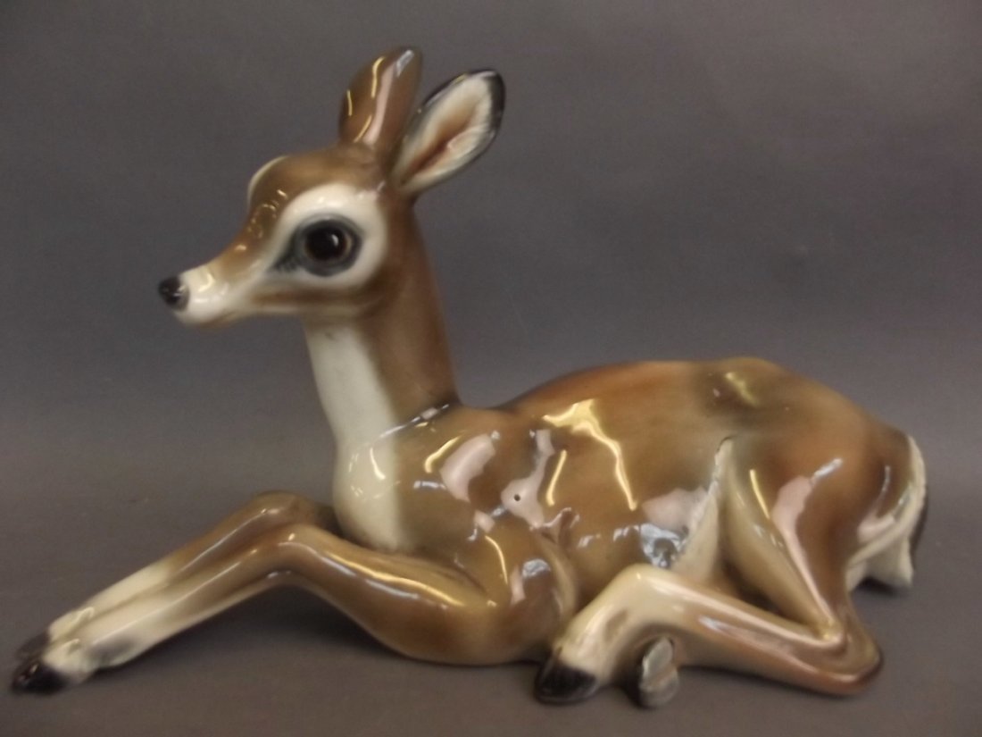 An Italian porcelain figure of a reclining deer, 12": An Italian porcelain figure of a reclining deer, 12" long