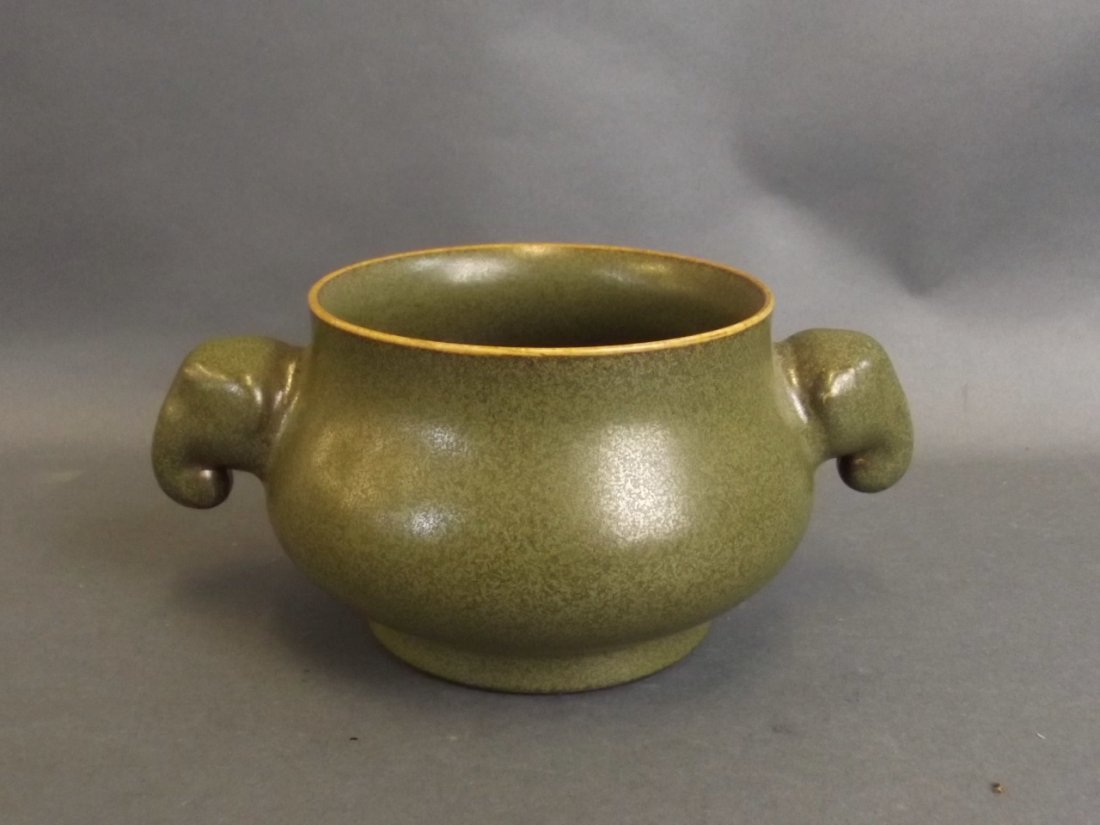 A Chinese porcelain censer with tea dust glazed: A Chinese porcelain censer with tea dust glazed decoration and twin elephant mask handles, seal mark to base, 5" diameter