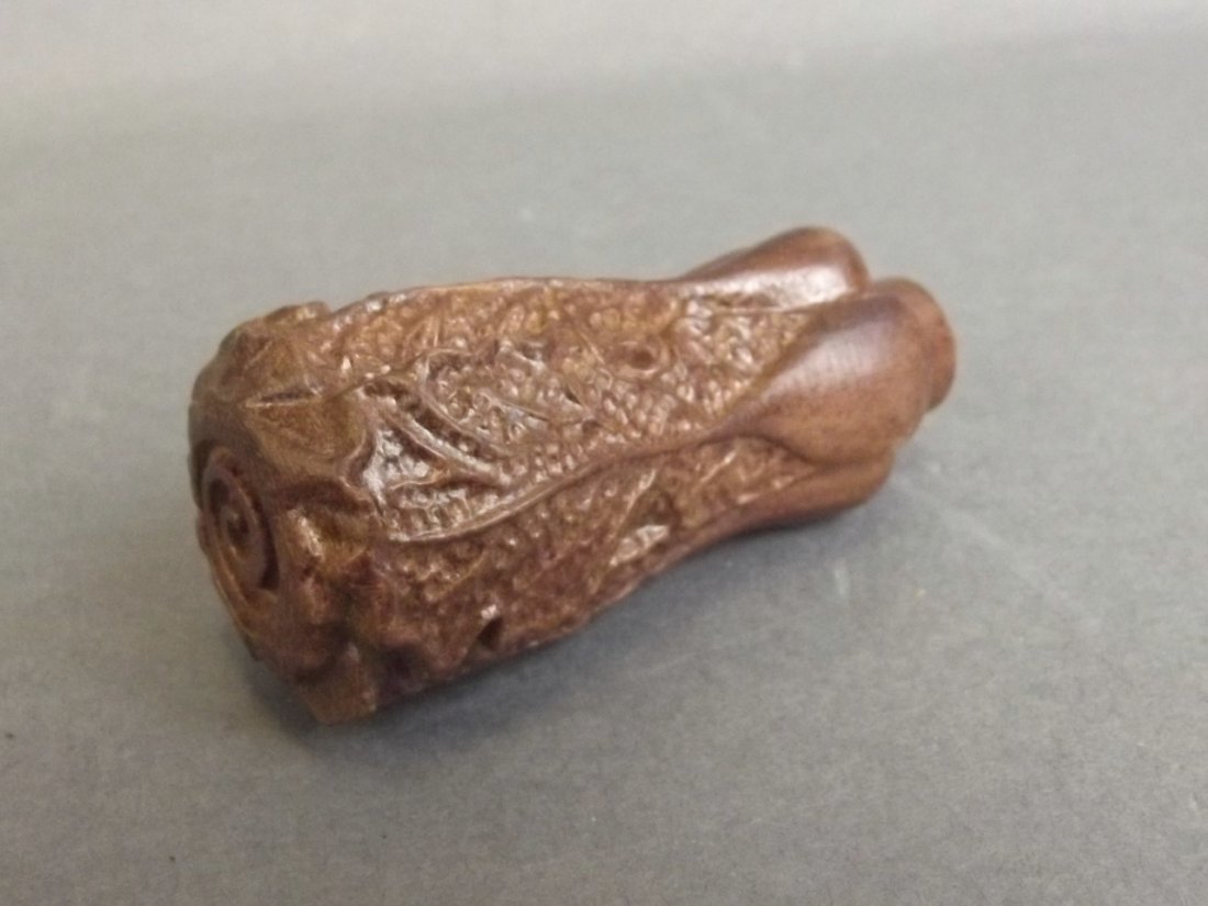 A Chinese carved hardwood toggle/walking stick hand in (1 of 2)