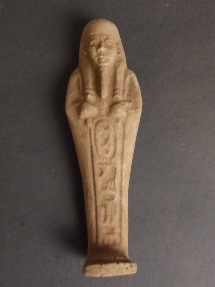 An Egyptian faience Shabti decorated with: An Egyptian faience Shabti decorated with hieroglyphics, 4" high