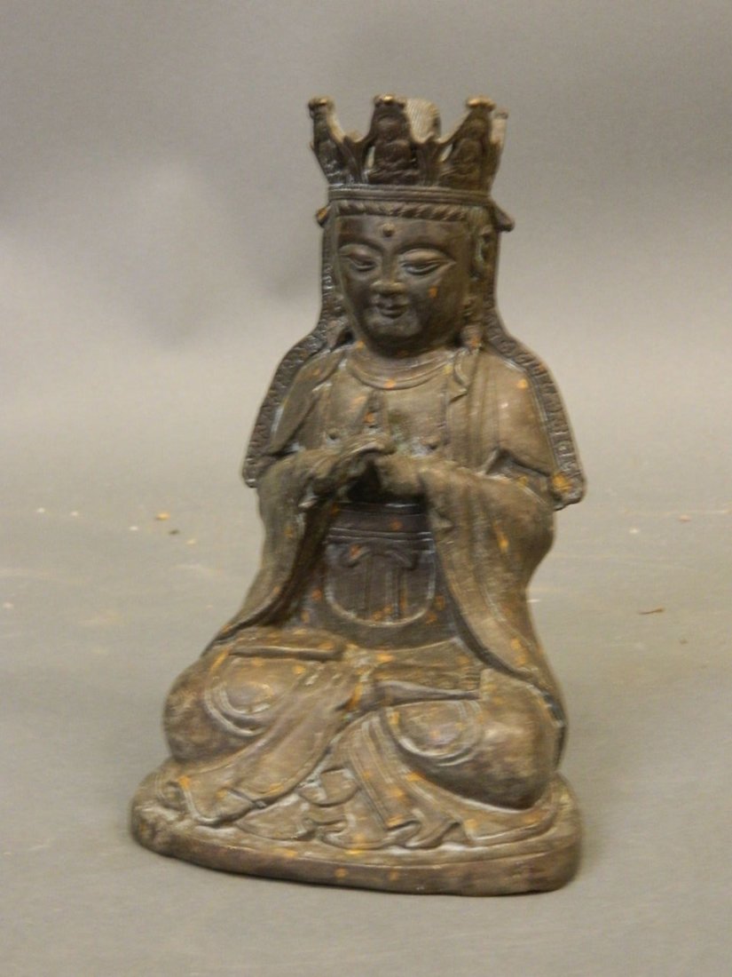 A bronzed metal figure of Buddha wearing a crown, (1 of 1)