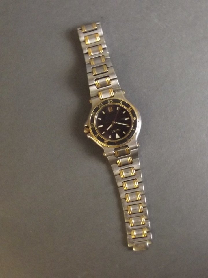 A Gucci gentleman's stainless steel wristwatch with: A Gucci gentleman's stainless steel wristwatch with gold plated embellishments (strap AF)