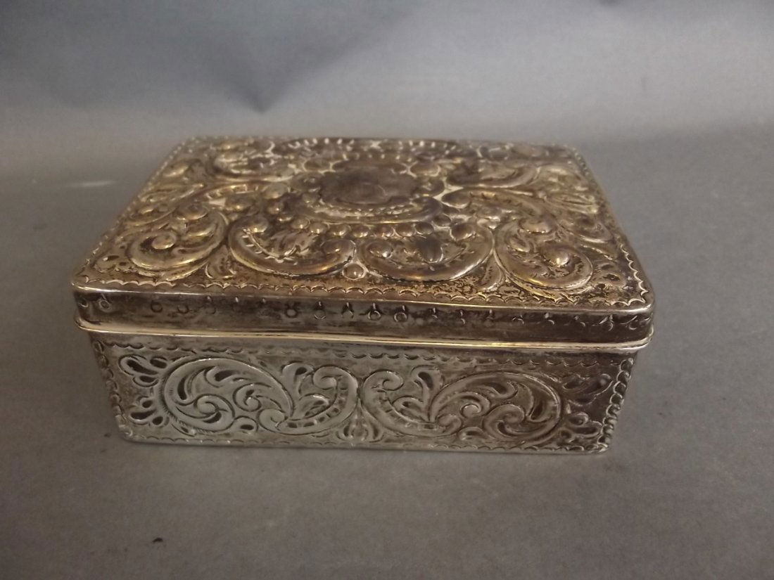 A rectangular Hallmarked silver trinket box with (1 of 3)