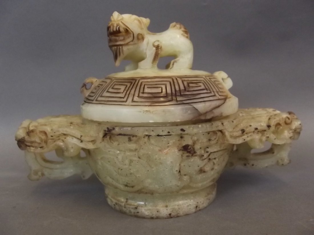 A Chinese carved jade koro and cover, the handles and: A Chinese carved jade koro and cover, the handles and knop carved as exotic beasts, 5" x 7"
