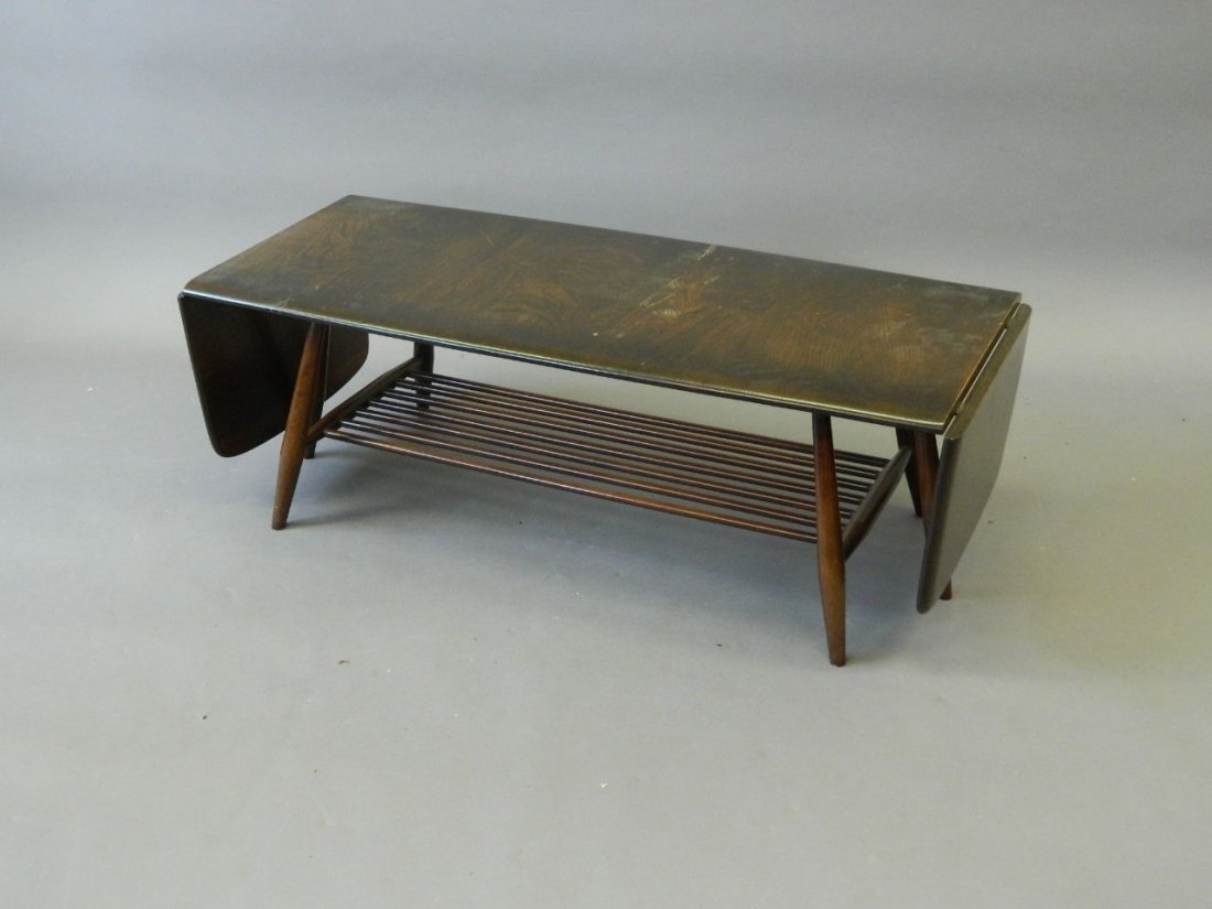 An Ercol drop end coffee table with slatted undertier,: An Ercol drop end coffee table with slatted undertier, 41" x 18" x 14"