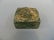 A Chinese square jade seal with carved decoration of an