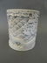 A Chinese white glazed porcelain brush pot with carved