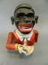 A replica cast iron money box in the form of a