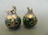A pair of Chinese jade ball paperweights encased in