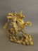 A Chinese gilt brass figure of a warrior on horseback,