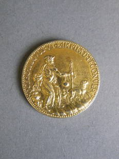 A C19th gilt metal electrotype replica of the: A C19th gilt metal electrotype replica of the Michelangelo coin commemorating the artist's 88th birthday, after the 1561 original cast by Leone Leoni, 1" diameter