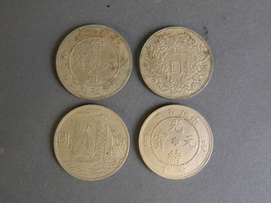 A collection of four early Chinese silvered metal (1 of 2)