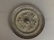 An antique Chinese bronze mirror with embossed
