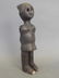 An antique ethnic carved wood figure of a woman