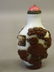 A Peking glass snuff bottle with overlaid carved - 3
