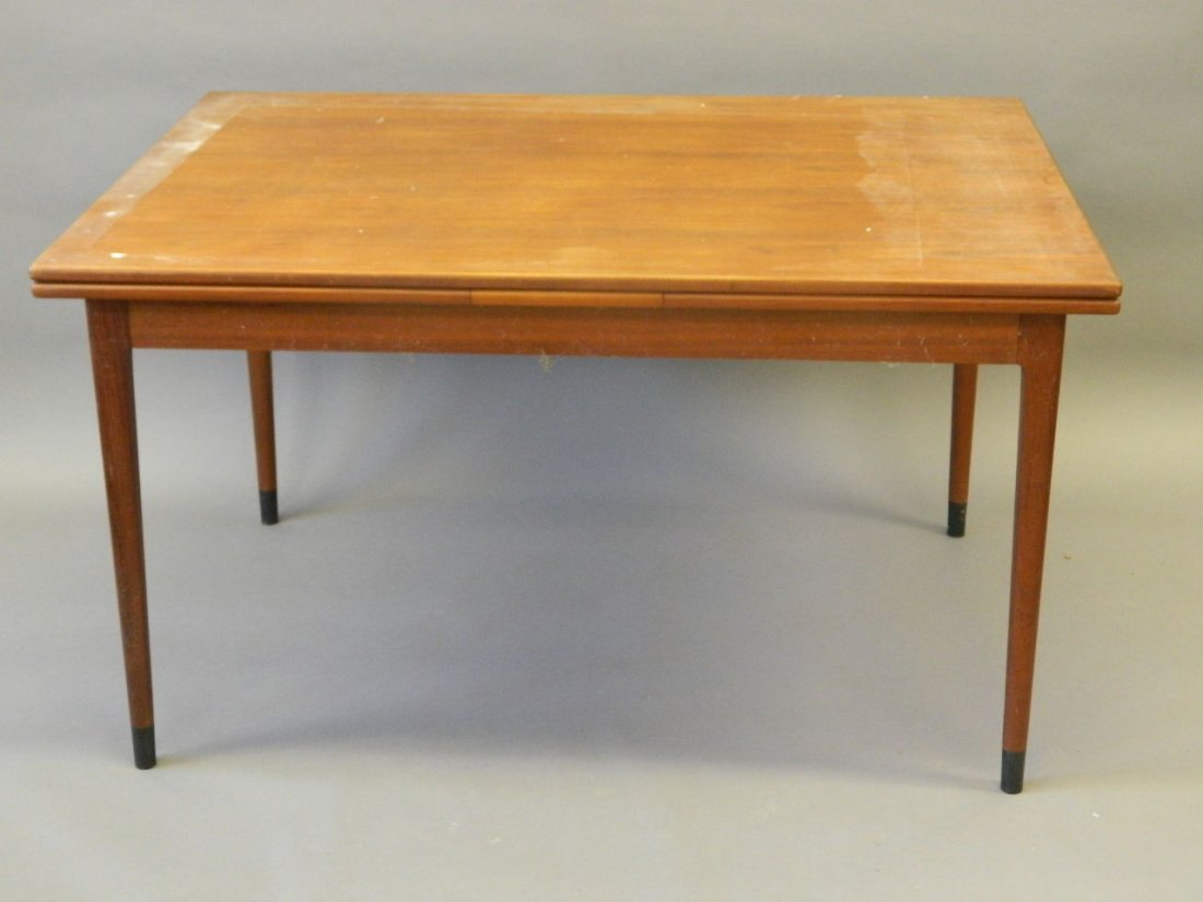 A Danish Moller teak draw leaf dining table, to be sold: A Danish Moller teak draw leaf dining table, to be sold on behalf of the RFC Veterans Association, 35" x 51" x 93" extended