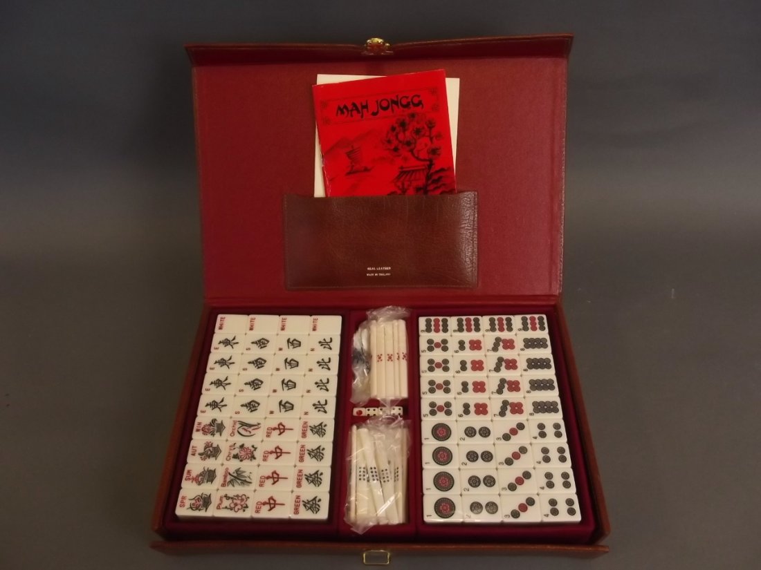 A leather cased Mahjong set with instructions (1 of 2)