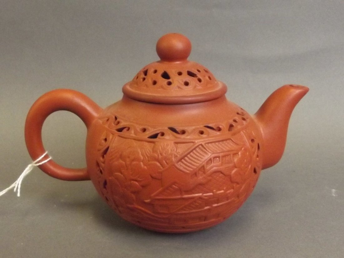 A Chinese Yixing terracotta teapot with pierced temple (1 of 4)