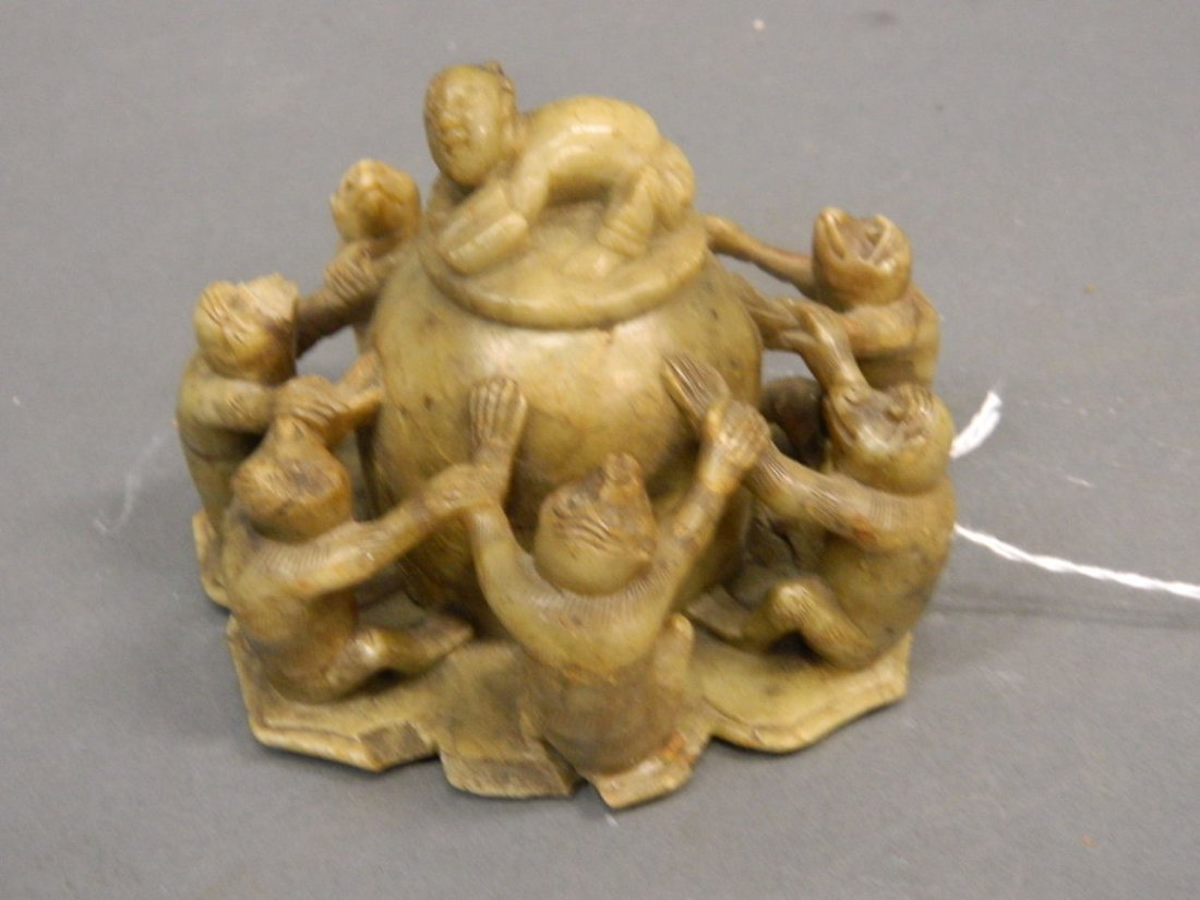 A Chinese carved soapstone pot and cover in the form of (1 of 3)
