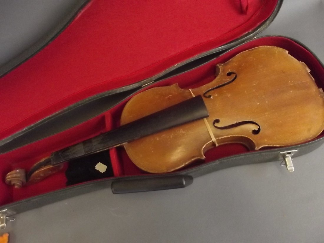 A violin with two piece back, bears label 'G. (1 of 5)