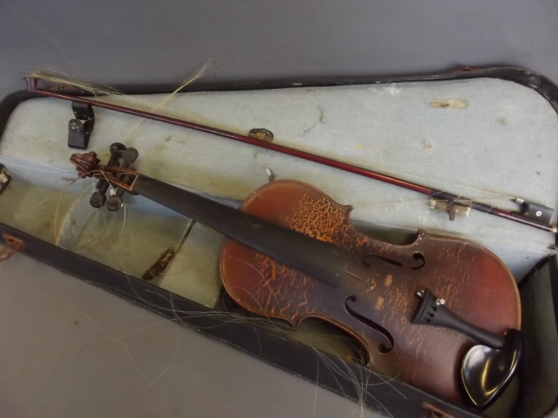 An early violin and bow with two piece back, in a case (1 of 5)