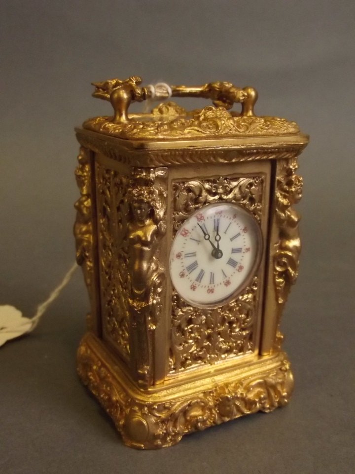 A brass rococo style cased miniature carriage clock, 3" (1 of 2)