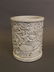 A Chinese Blanc de Chine brush pot with relief twin