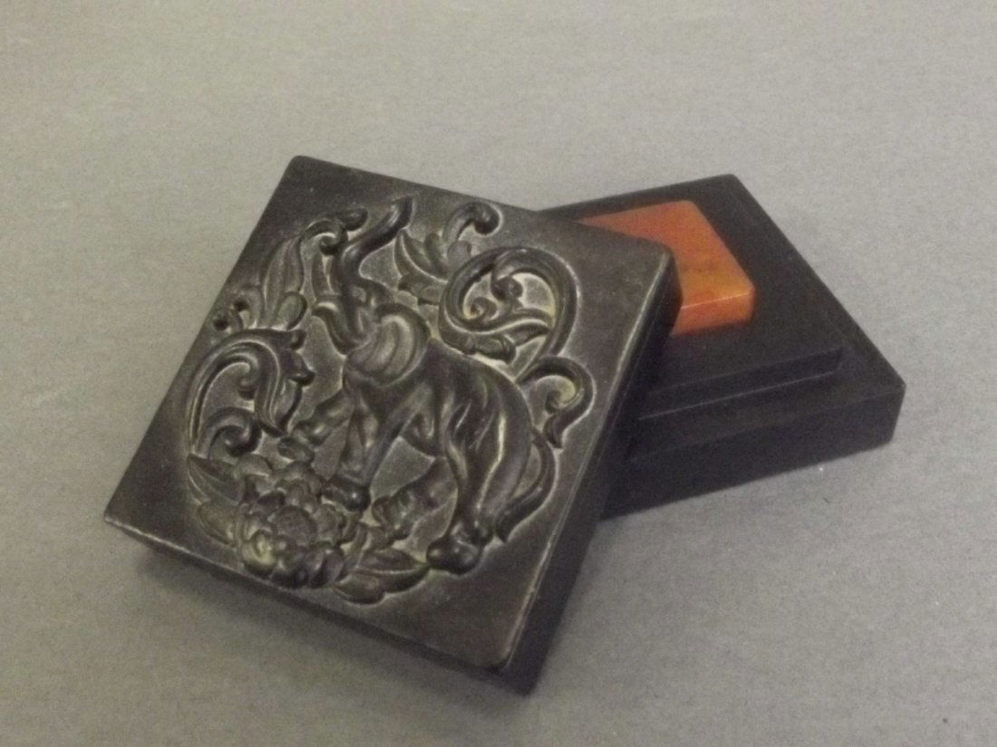 A Chinese black soapstone box with carved elephant (1 of 3)