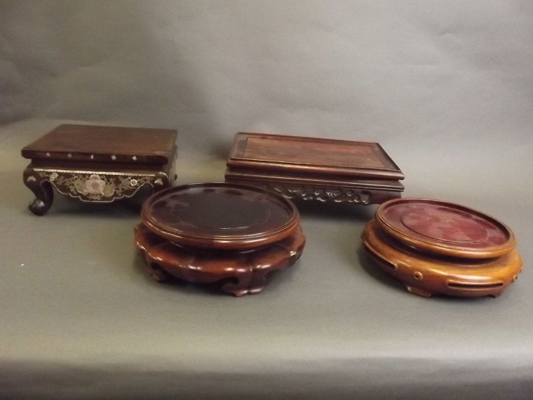 A Chinese circular carved hardwood pot stand, together (1 of 3)