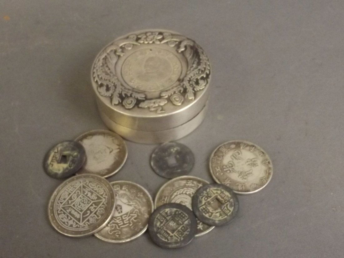 A Chinese white metal ink pot with inset coin and twin (1 of 3)