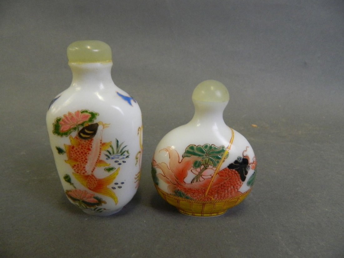 A pair of Peking glass snuff bottles with enamelled: A pair of Peking glass snuff bottles with enamelled decoration of carp amongst water lilies, 3 character mark to bases, 3_" high