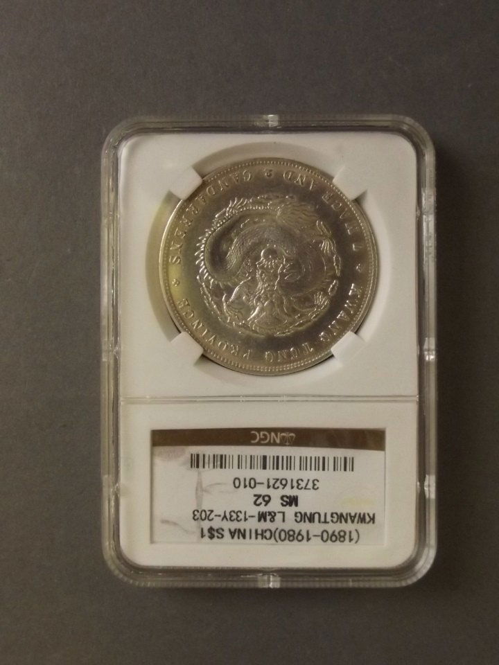 A Chinese white metal coin, Kwang Tung Province, in a (1 of 2)