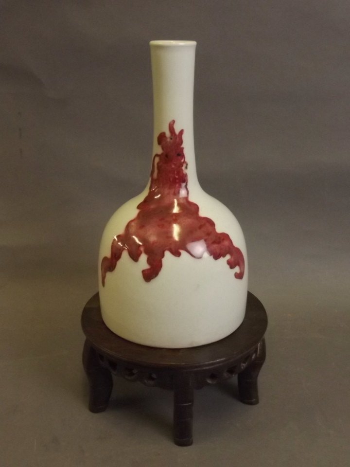 A Chinese red and white porcelain bottle vase with (1 of 3)