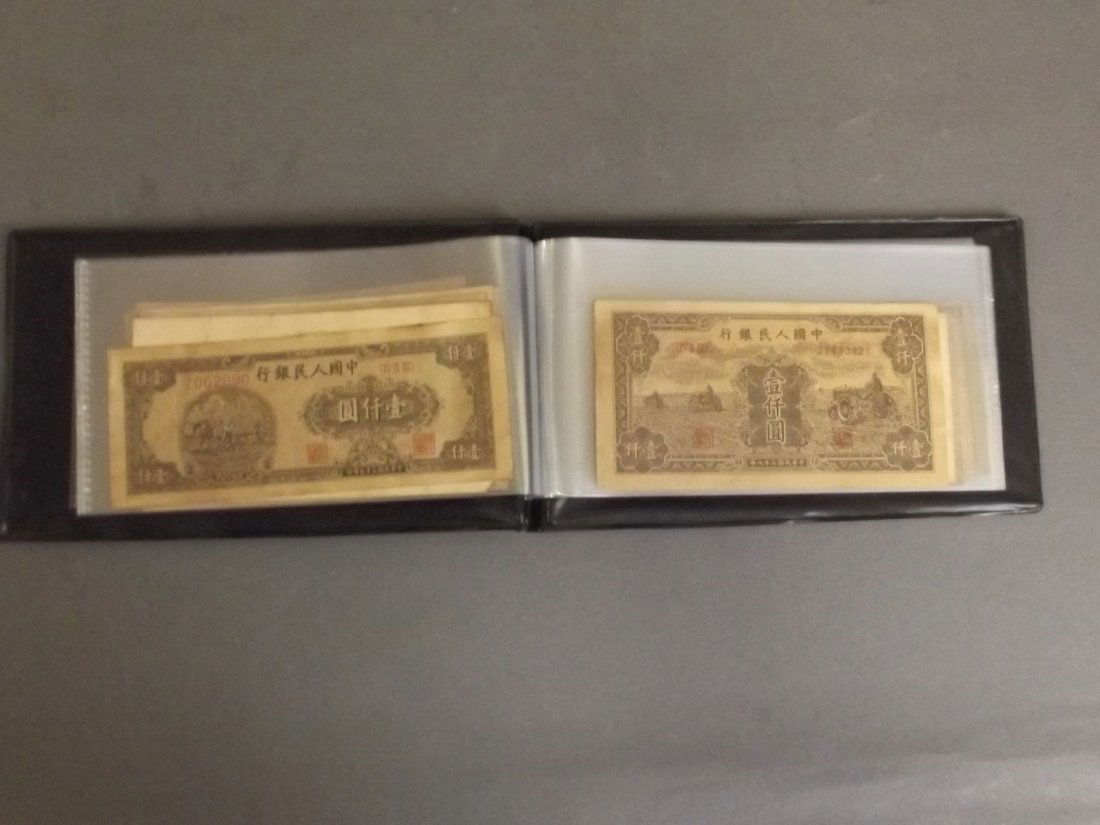A wallet containing a quantity of facsimile Chinese (1 of 8)