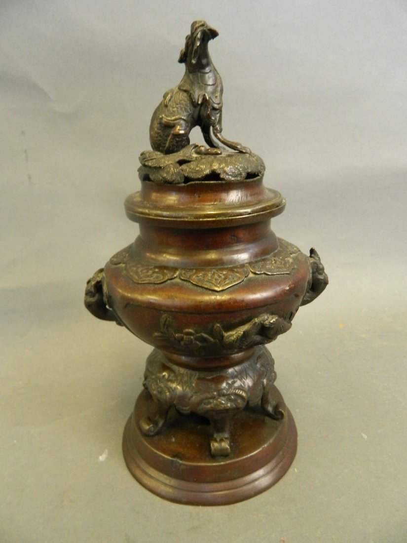 A Chinese bronze censer cast with birds and flowering (1 of 3)