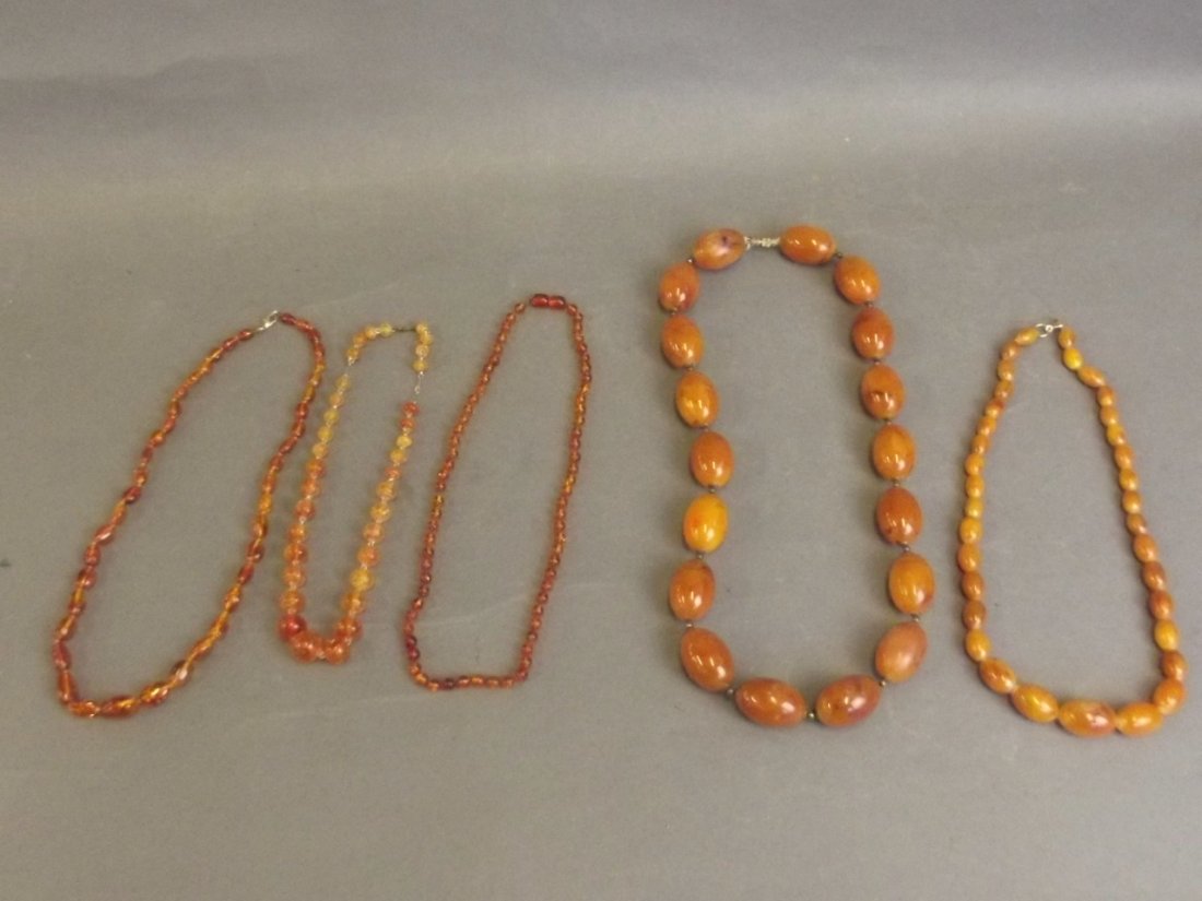 Five strings of amber and amber coloured beads, longest (1 of 6)