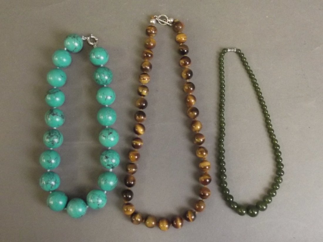 A string of graduated spinach jade beads, a large (1 of 3)