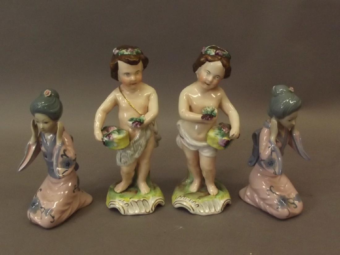 A pair of Continental porcelain figures of Putti (1 of 1)