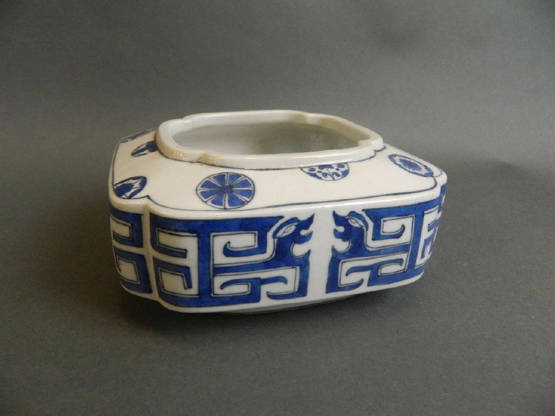 A Chinese blue and white porcelain censer with archaic: A Chinese blue and white porcelain censer with archaic style dragon decoration, seal mark to base, 6½" square