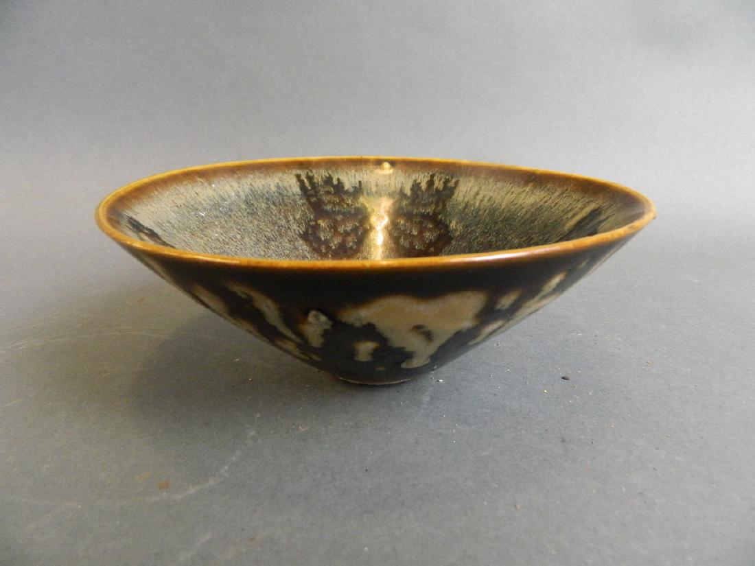 A Chinese Jizhou kiln pottery bowl with butterfly: A Chinese Jizhou kiln pottery bowl with butterfly decoration, 6½" diameter