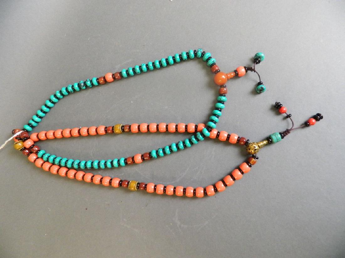 A string of turquoise style beads with amber style (1 of 2)