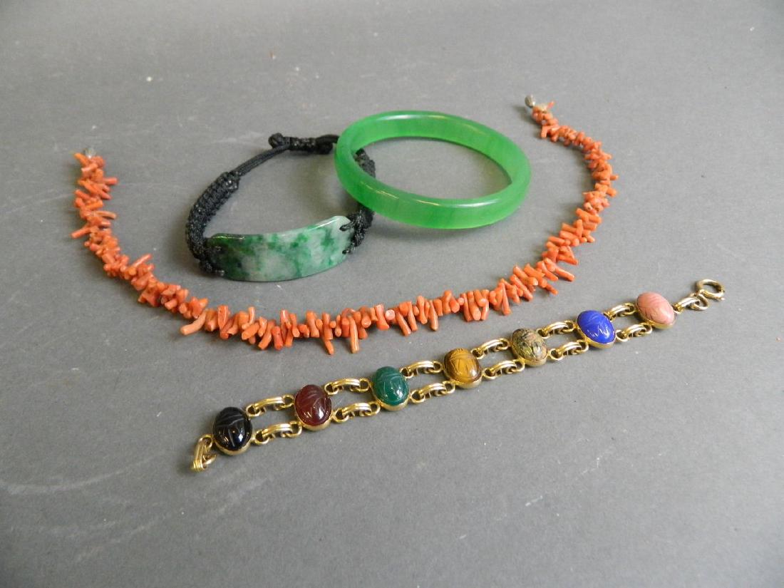 A coral bead choker, together with a mottled green jade (1 of 3)