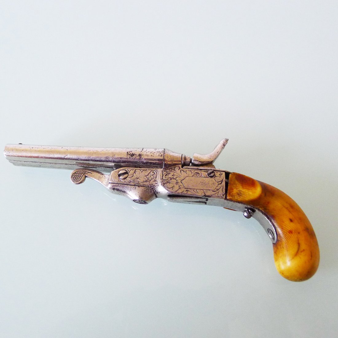 ANTIQUE ITALIAN SMALL PISTOL: Italian antique ivory handle small pistol, about 100 years, 7" long, 210 g.