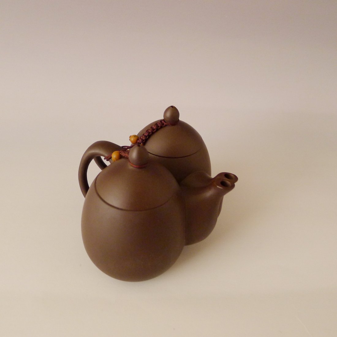 CHINESE YIXING CLAY TEAPOT: 中國宜興紫砂茶壺 Chinese clay teapot, design with two teapots, you can use two kinds of tea for it, size: 8 cm x 11 cm x 10 cm.