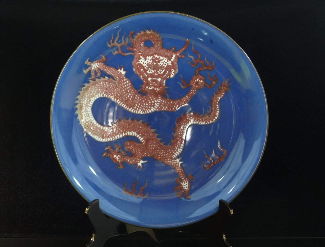 CHINESE PORCELAIN PLATE: Chinese Porcelain Big Plate, the blue glazed plate, the red glazed dragon designed on the middle of plate, the seal mark of Kangxi Qing dynasty period, size: 18" (46 cm) diameter.