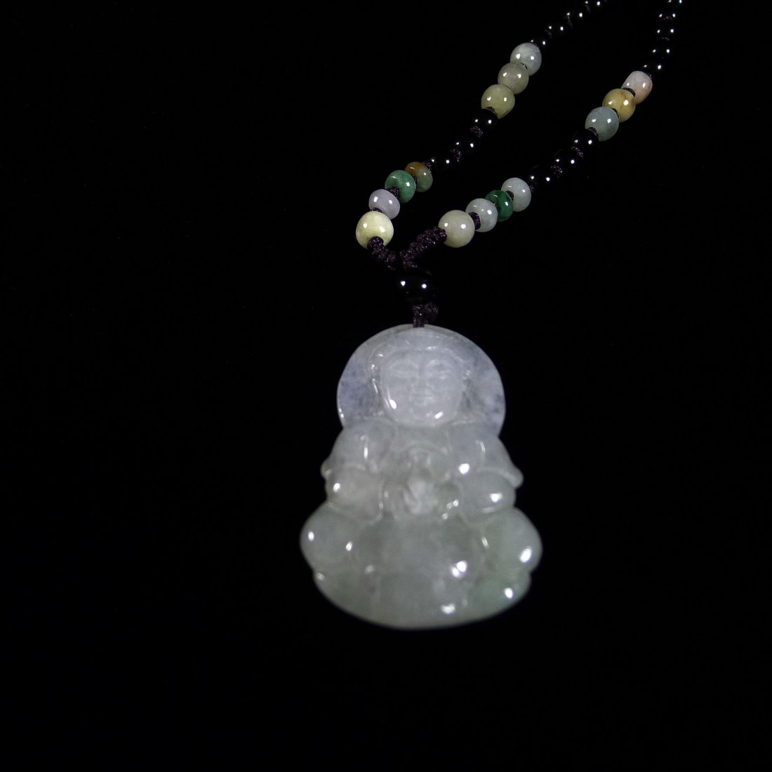 CHINESE JADEITE PENDANT (A): Chinese jadeite pendant (A), with certificate, carving Guanyin design, the chain designed obsidian and jade/jadeite design adjustable 60 cm long, the pendant size: 4.5 cm x 3 cm x 0.5 cm, weight: 11.6