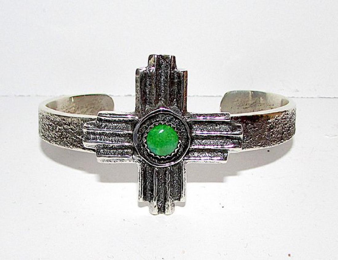 Navajo Sand Cast Tufa Cast Sterling Silver Carico Lake: For your consideration is this outstanding vintage sterling silver Carico Lake mine turquoise cuff bracelet with Zia Symbol design by an award winning and highly collectible Navajo artist Gary Custer.