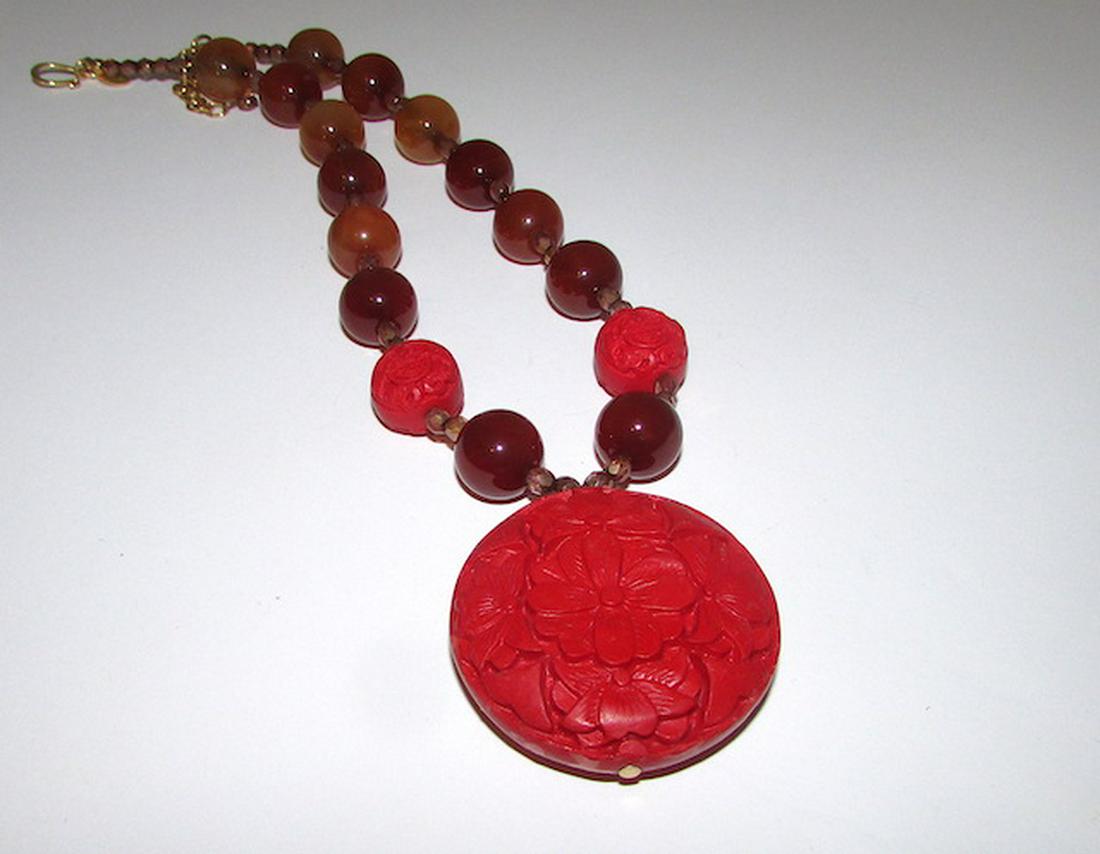 Vintage Kenneth J Lane KJL Designer Necklace: Vintage Kenneth J Lane KJL Designer Necklace. Great condition. Carnelian beads, cinnabar carved pendant. Singed by the designer. 21" long, pendant 2" by 1 3/4". Fab.