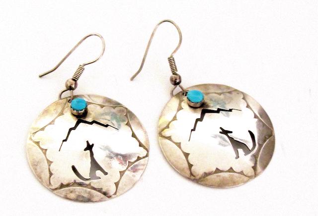Vintage Navajo Sterling Turquosie Earrings: Vintage Navajo Sterling Turquosie Earrings. Cut out coyote and mesas design. Statement dangle pieces. Measure 2" long byt a1 1/4". Fab pieces. Marked sterling, AC