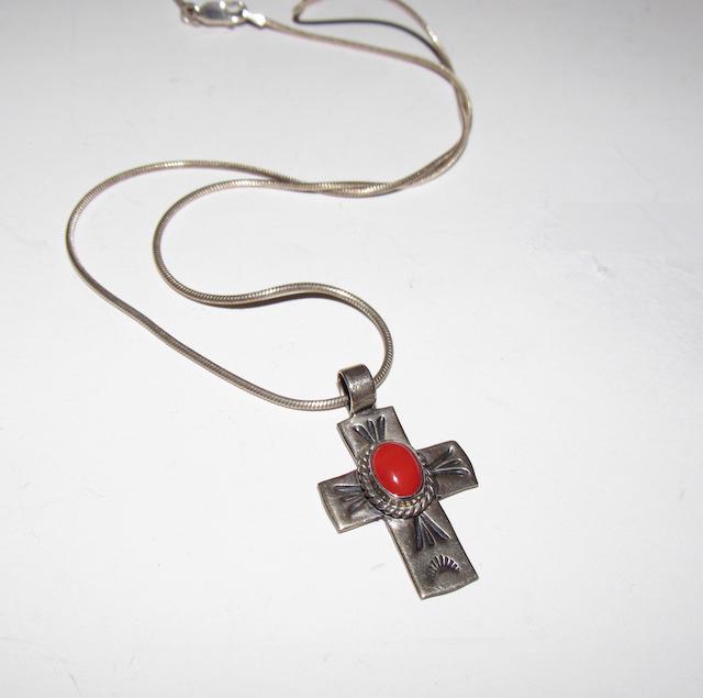 Navajo A Cadman Sterling Coral Cross: Navajo A Cadman Sterling Coral Cross. The cross pendant comes with the sterling silver necklace Singed, marked, tested. The cross measures 1 1/2" by 3/4". The necklace is 18" long